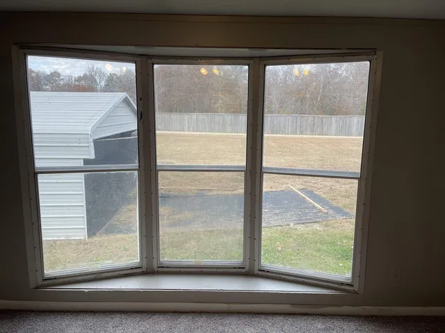 a view of room with window and cabinet