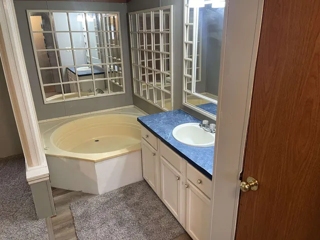 a white toilet sitting next to a small sink