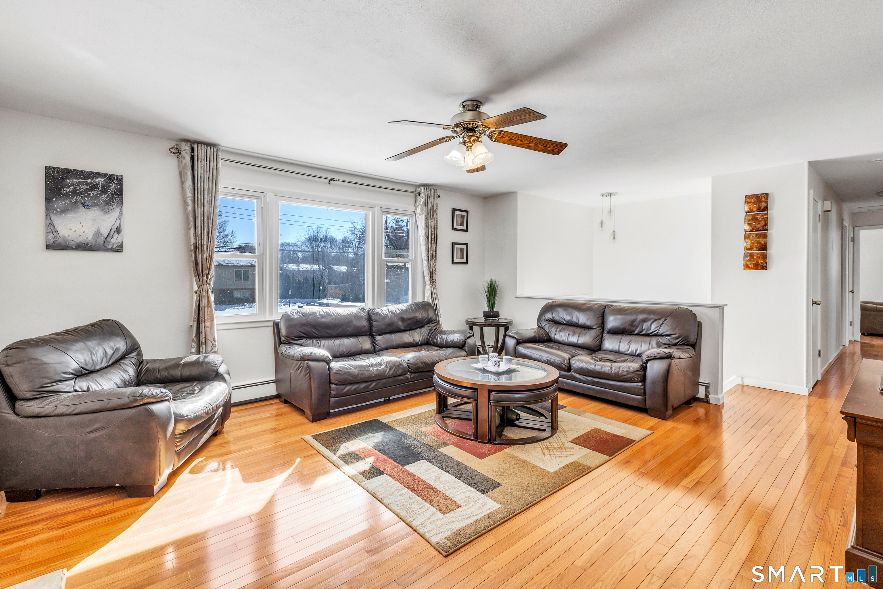 39 Zephyr Road Trumbull, CT 06611 - Photo 12 of 36 a living room with furniture and a large window