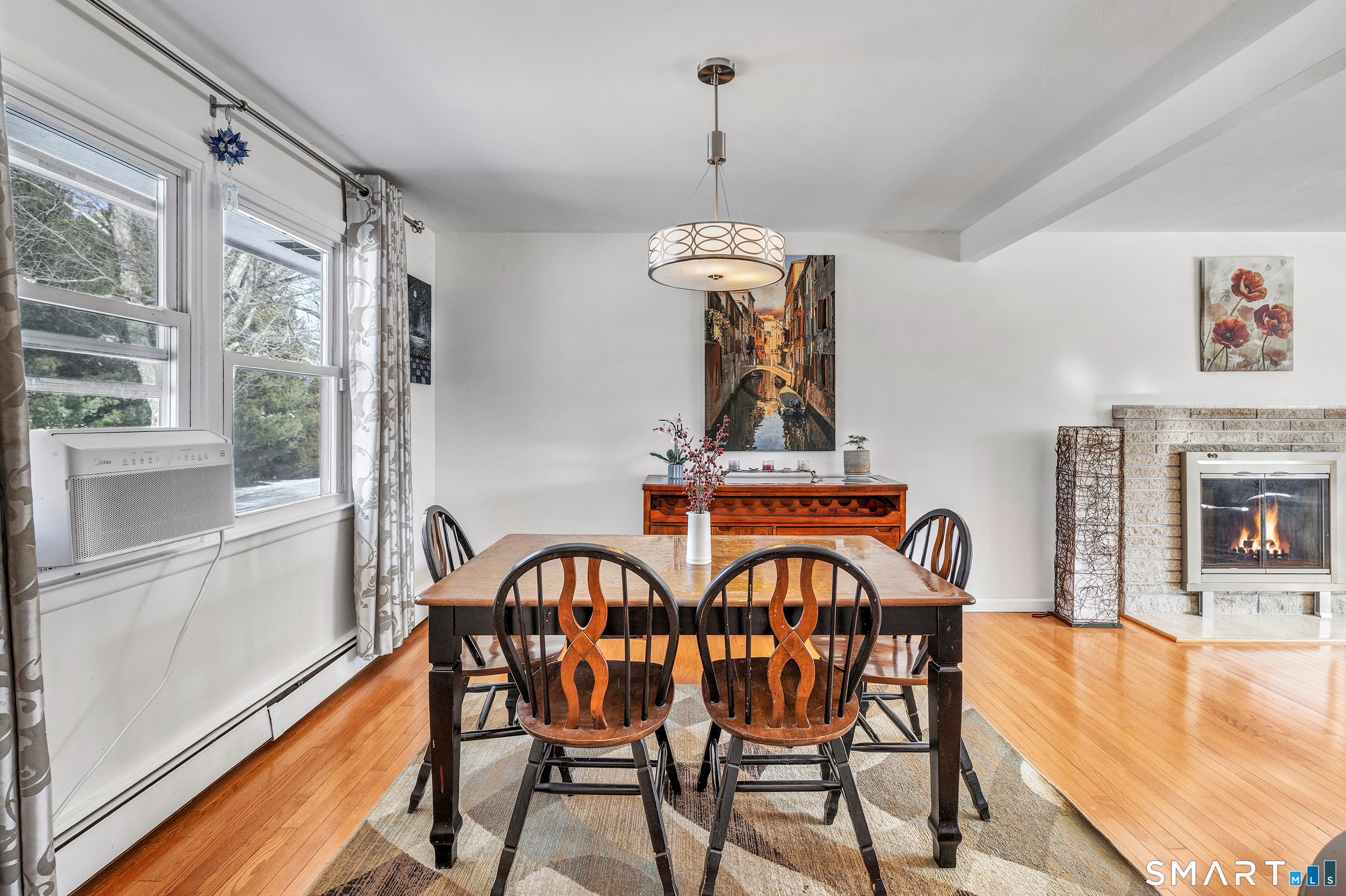 39 Zephyr Road Trumbull, CT 06611 - Photo 16 of 36 a dining room with furniture a chandelier and wooden floor