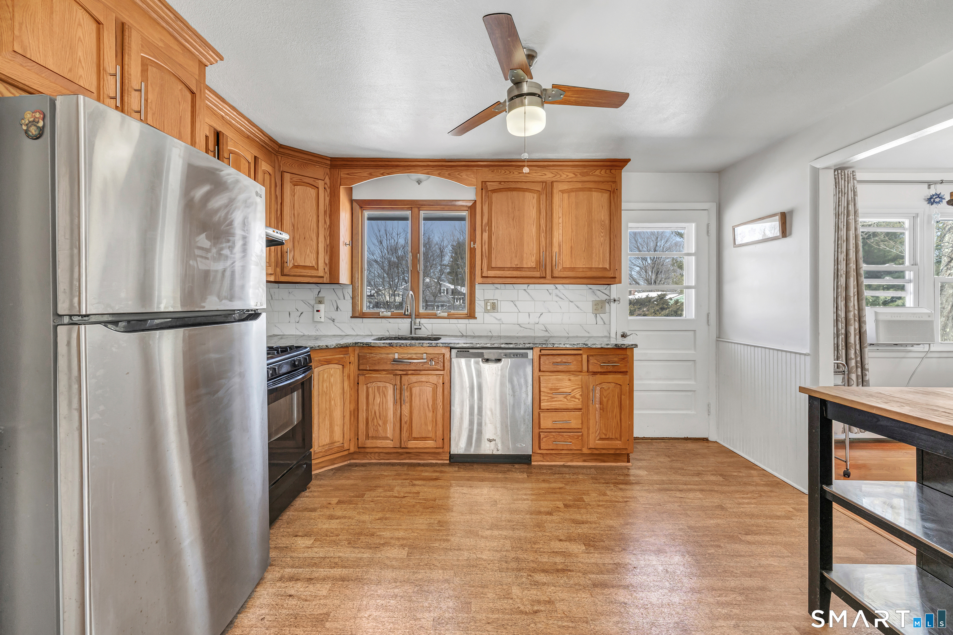 39 Zephyr Road Trumbull, CT 06611 - Photo 20 of 36 a kitchen with stainless steel appliances granite countertop a refrigerator a stove and a sink
