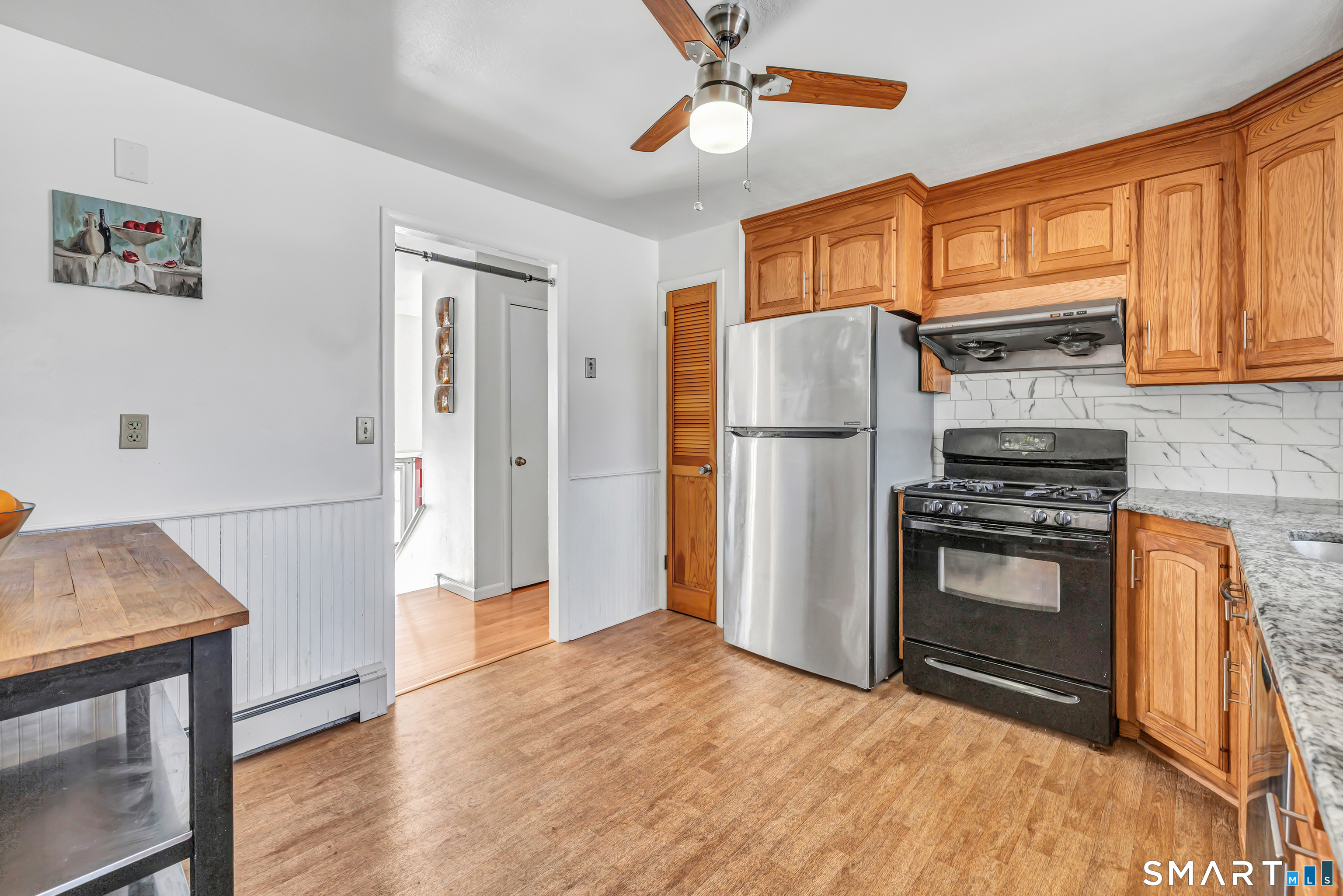 39 Zephyr Road Trumbull, CT 06611 - Photo 23 of 36 a kitchen with stainless steel appliances a refrigerator and a stove top oven