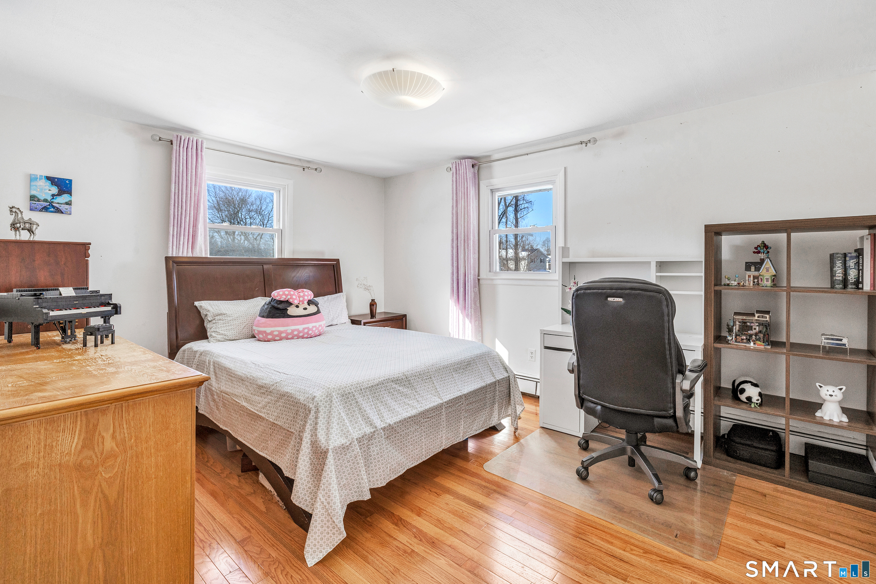 39 Zephyr Road Trumbull, CT 06611 - Photo 25 of 36 a bedroom with a bed and a desk