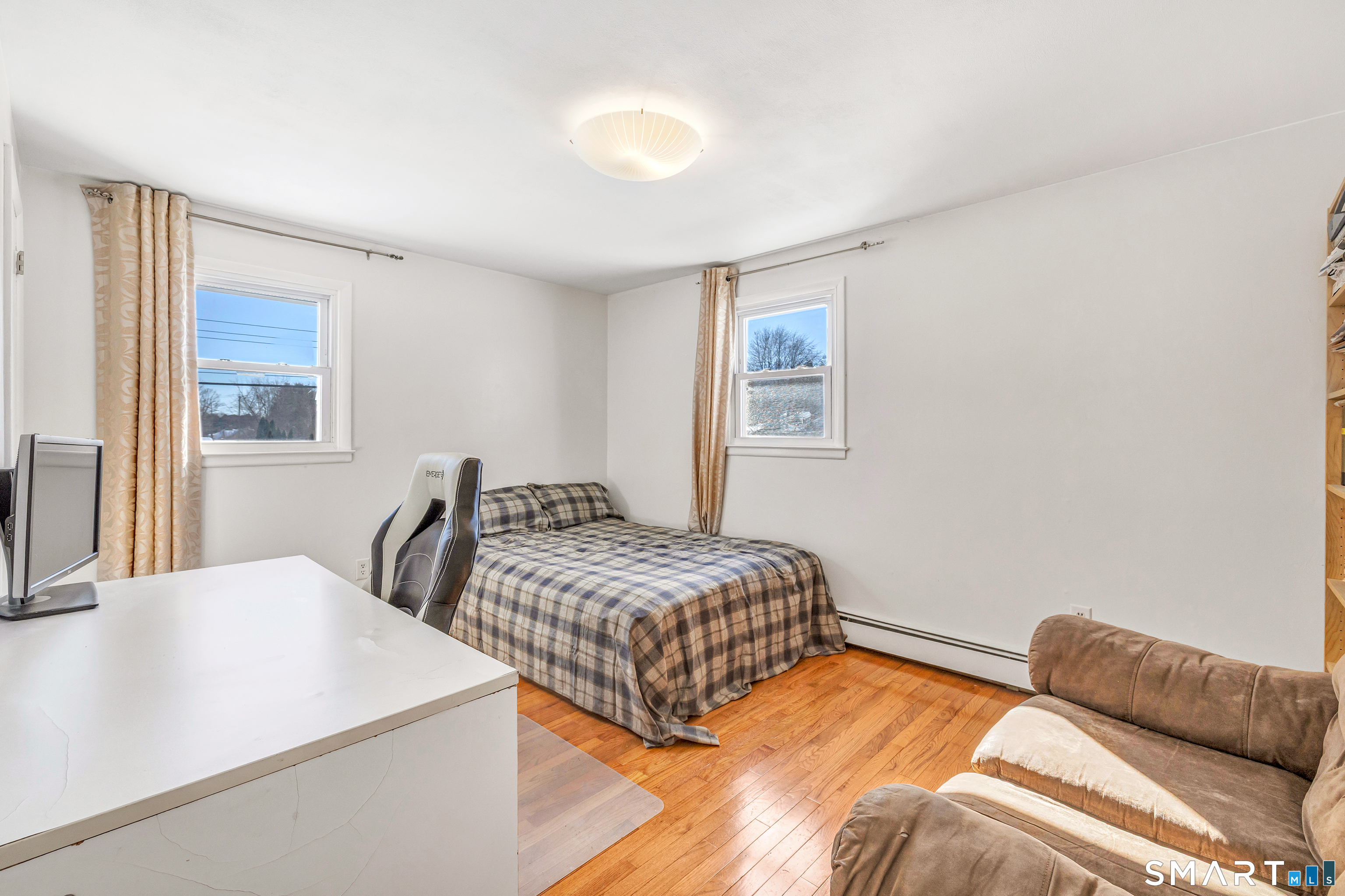 39 Zephyr Road Trumbull, CT 06611 - Photo 27 of 36 a bedroom with a bed and a night stand