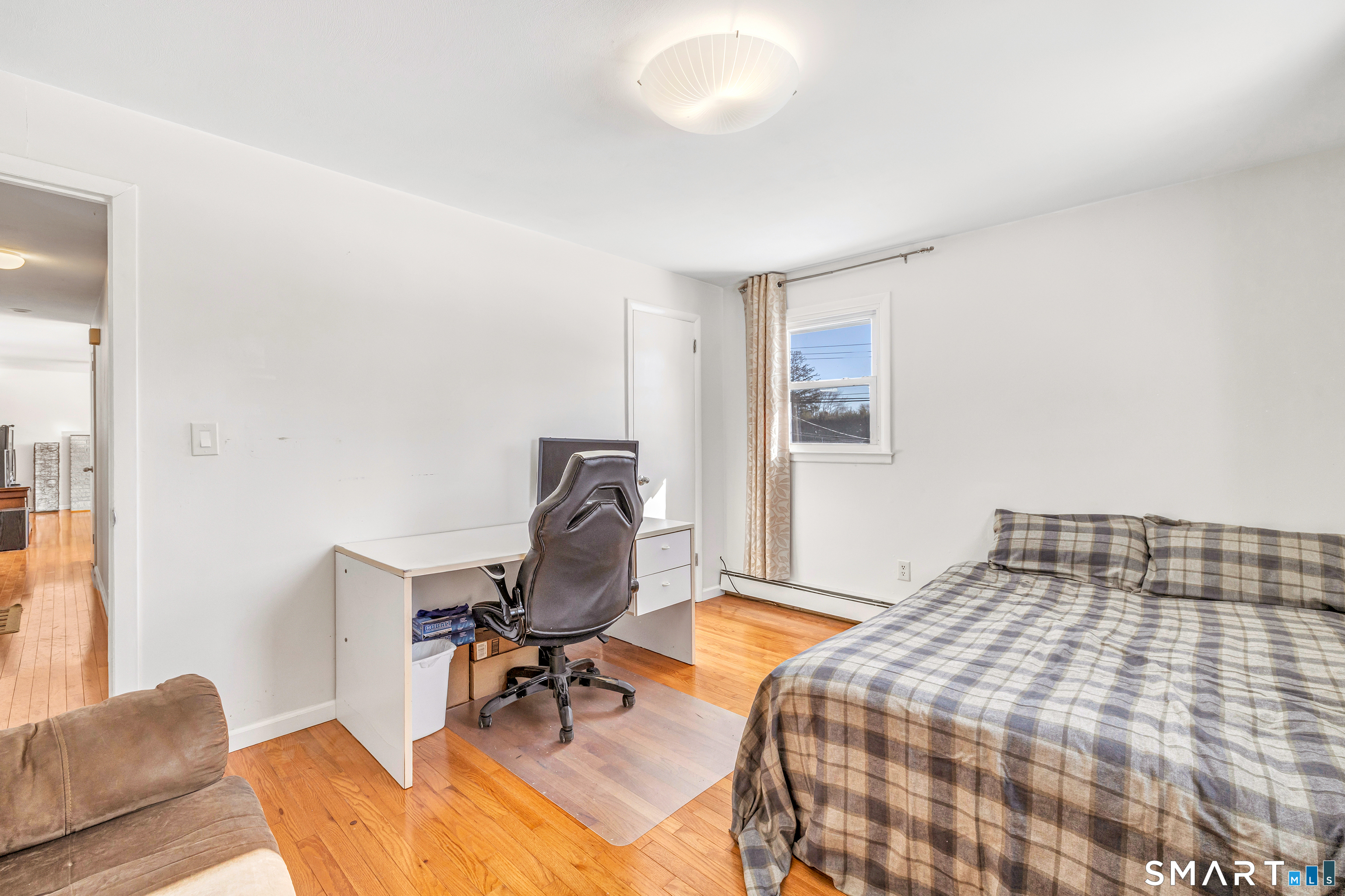 39 Zephyr Road Trumbull, CT 06611 - Photo 28 of 36 a bedroom with a bed and a desk