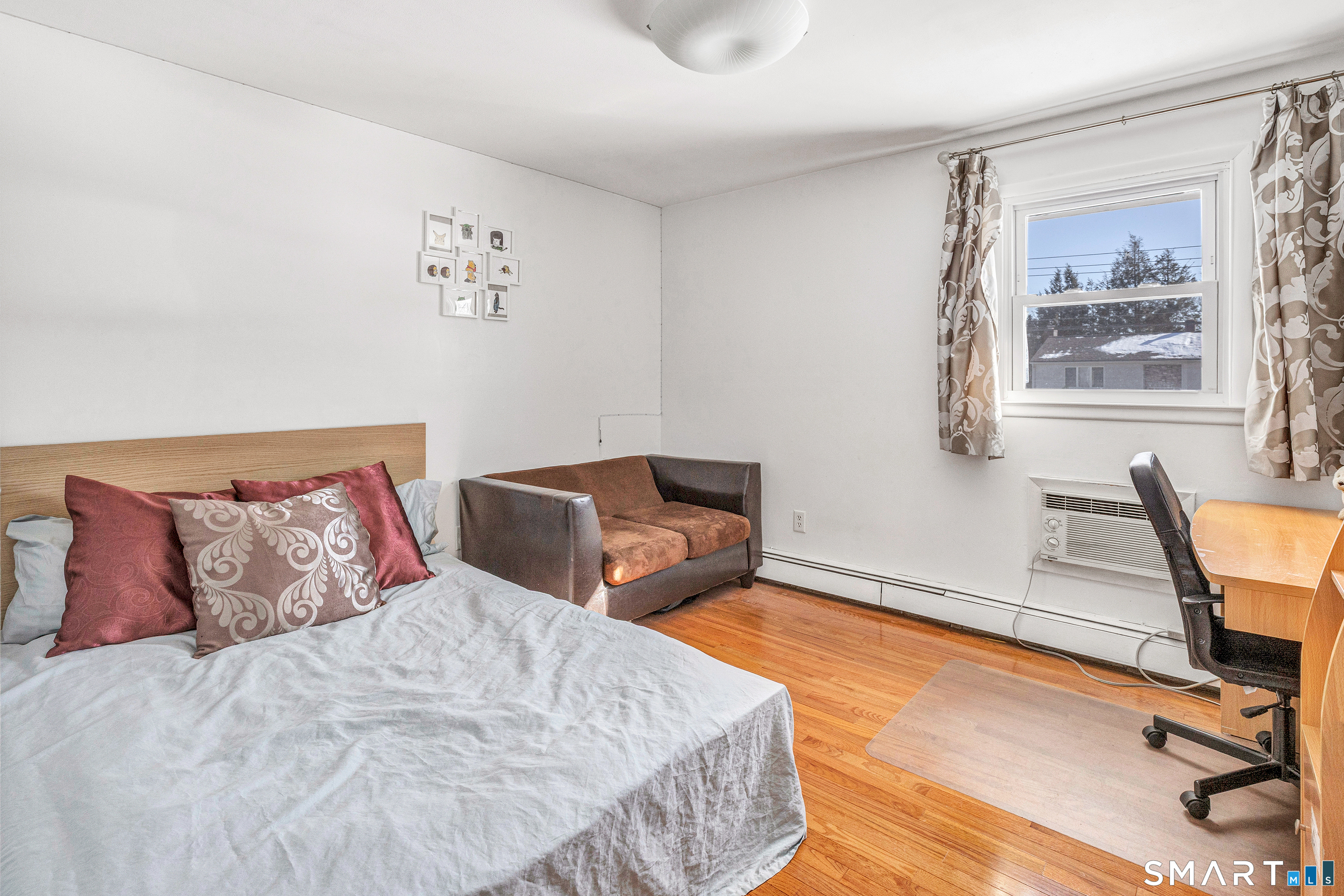 39 Zephyr Road Trumbull, CT 06611 - Photo 29 of 36 a bedroom with two beds and a window