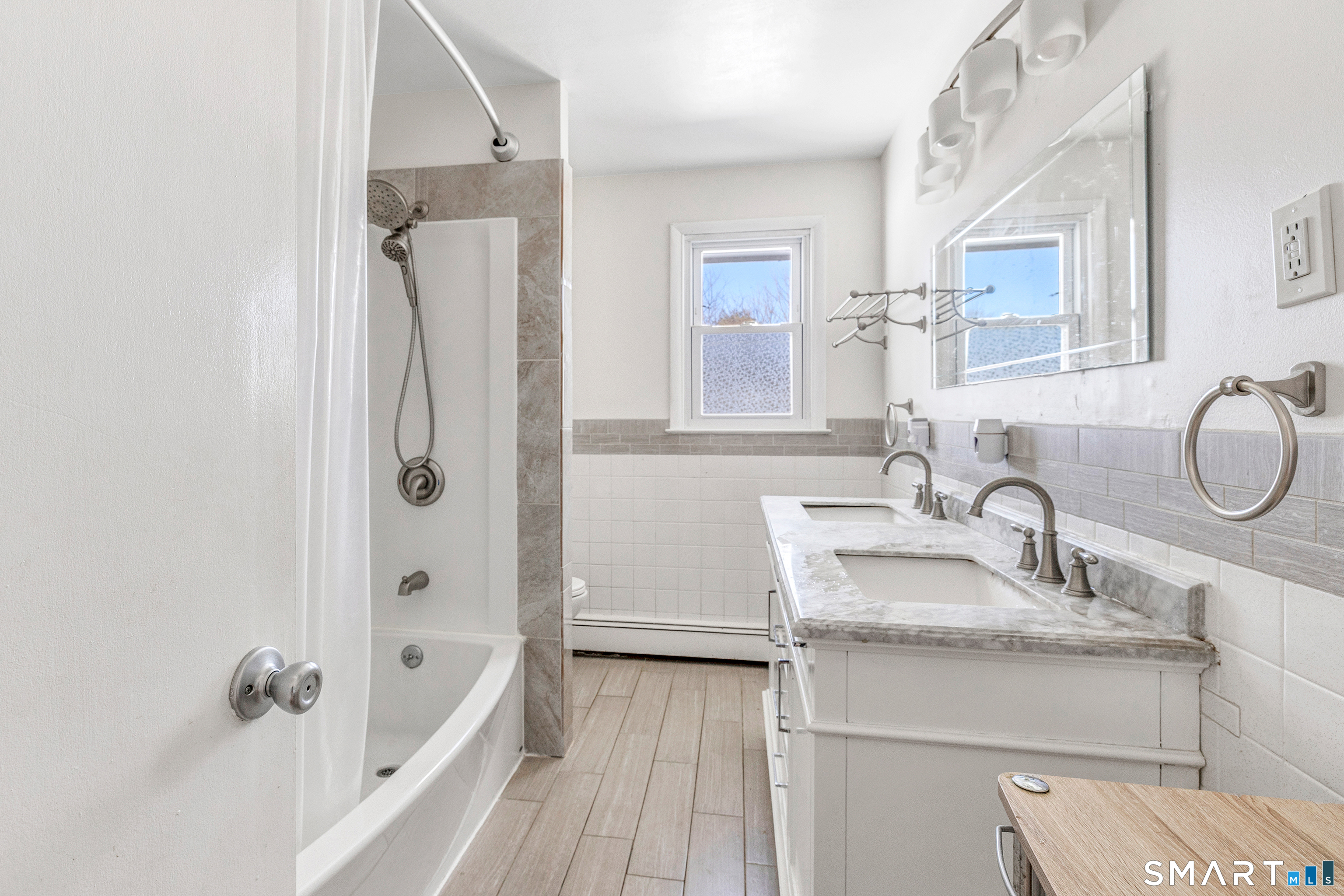 39 Zephyr Road Trumbull, CT 06611 - Photo 30 of 36 a bathroom with a sink a toilet and shower