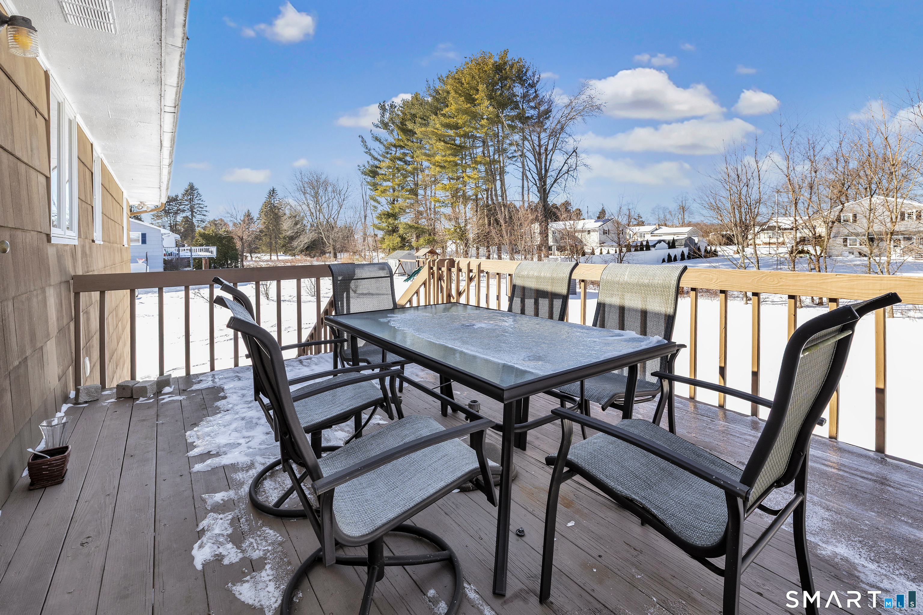 39 Zephyr Road Trumbull, CT 06611 - Photo 4 of 36 a view of a roof deck with table and chairs