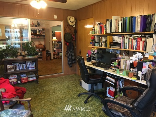 245 Messner Road Dayton, WA 99328 - Photo 11 of 30 a room with lots of furniture and a book shelf