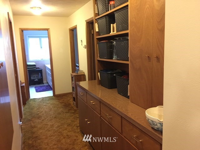 245 Messner Road Dayton, WA 99328 - Photo 12 of 30 a view of hallway with sink and mirror