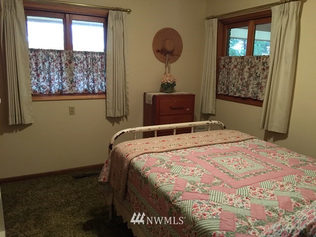 245 Messner Road Dayton, WA 99328 - Photo 15 of 30 a bedroom with a bed and a window