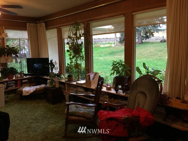 245 Messner Road Dayton, WA 99328 - Photo 5 of 30 a living room with furniture and a floor to ceiling window