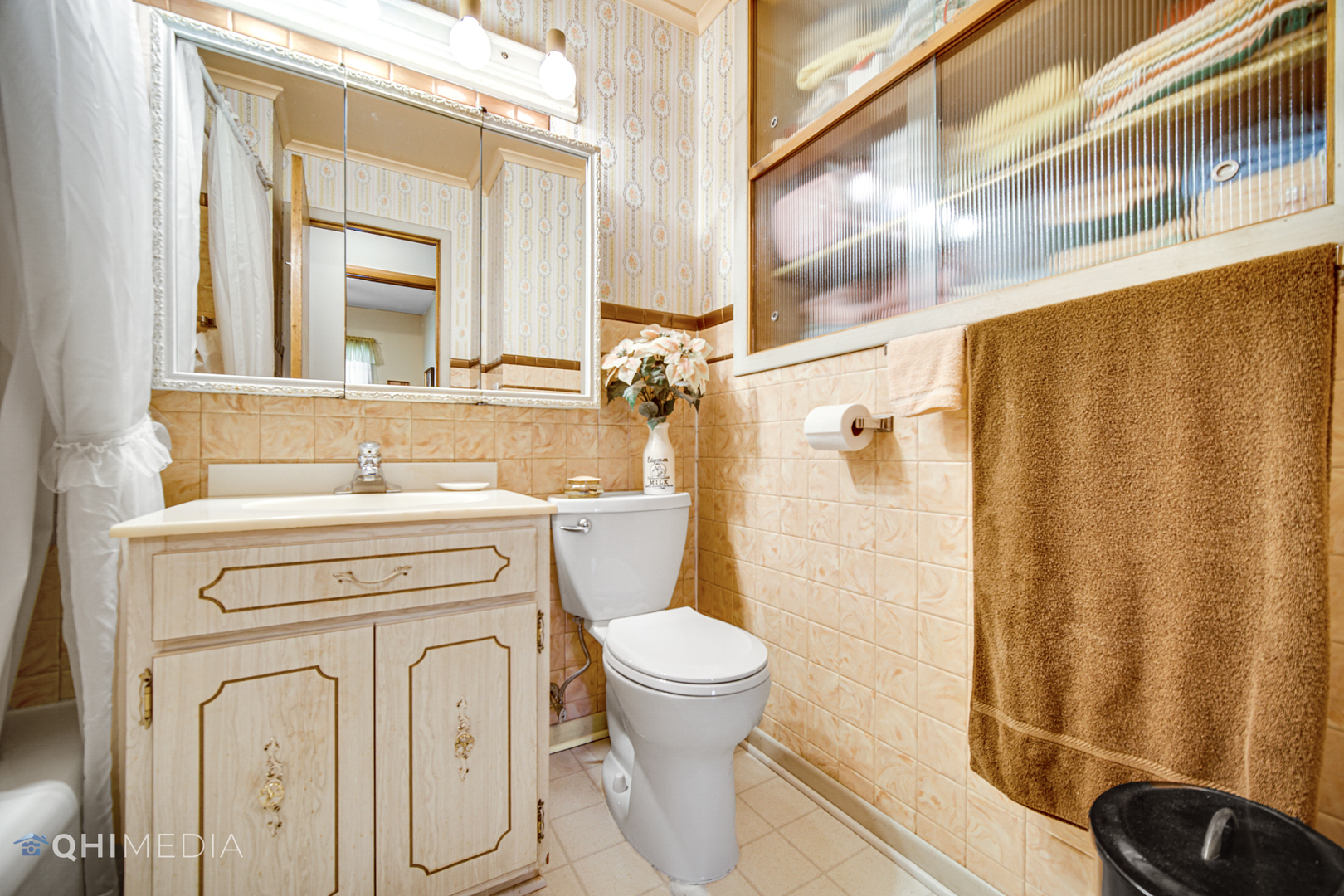74 Arrowhead Drive Thornton, IL 60476 - Photo 14 of 26 a bathroom with a sink a toilet and a mirror