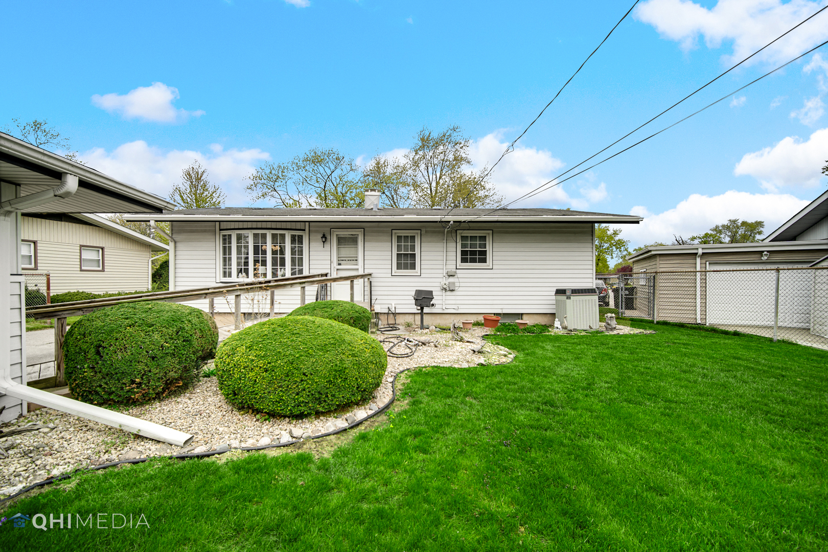 74 Arrowhead Drive Thornton, IL 60476 - Photo 22 of 26 a front view of house with yard and outdoor seating