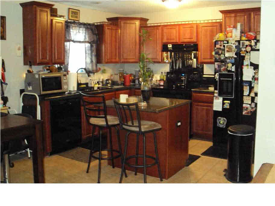 773 County Line Road Mendenhall, MS 39114 - Photo 7 of 17 kitchen with isle with bar stools