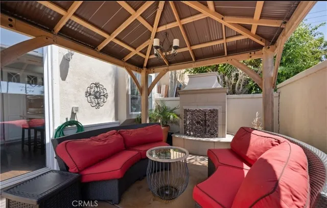 a outdoor living space with furniture and a fireplace