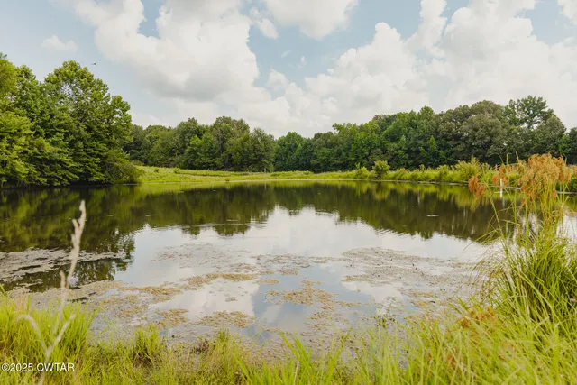a view of a lake with a big yard