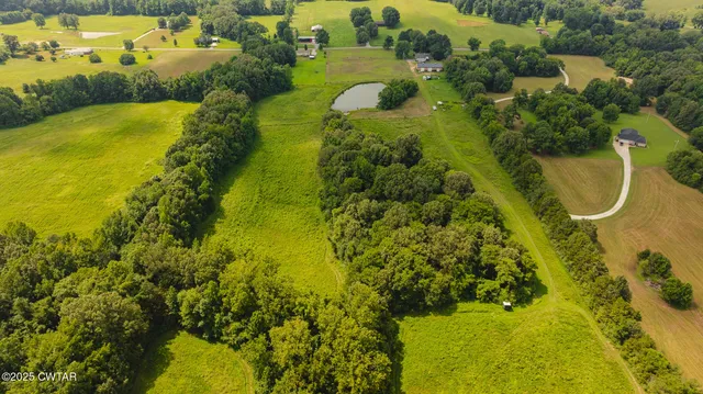 an aerial view of residential houses with swimming pool