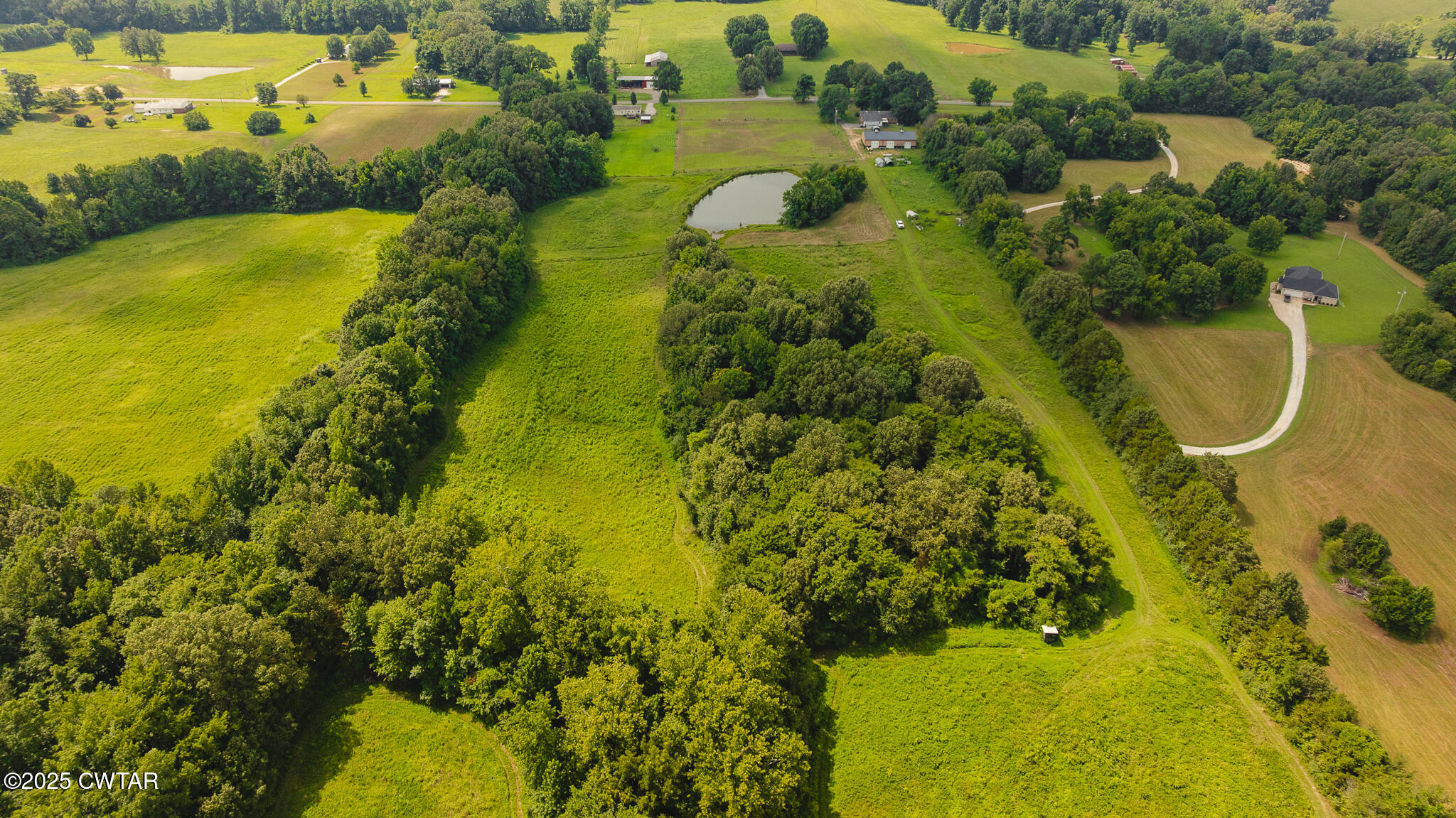 110 South J Hickerson Road Trenton, TN 38382 - Photo 4 of 42 an aerial view of residential houses with swimming pool