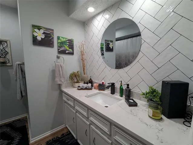 a bathroom with a sink and a mirror
