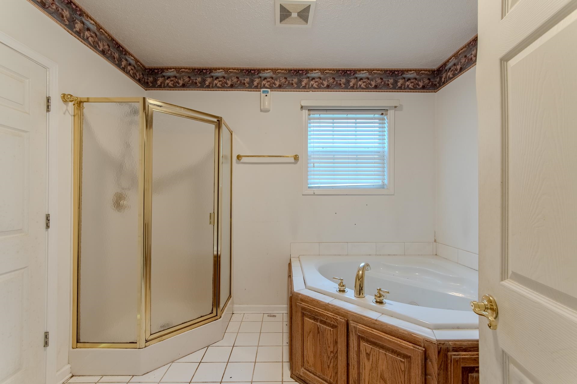 4985 Saltillo Road Saltillo, TN 38370 - Photo 19 of 40 a bathroom with a tub a sink and a mirror