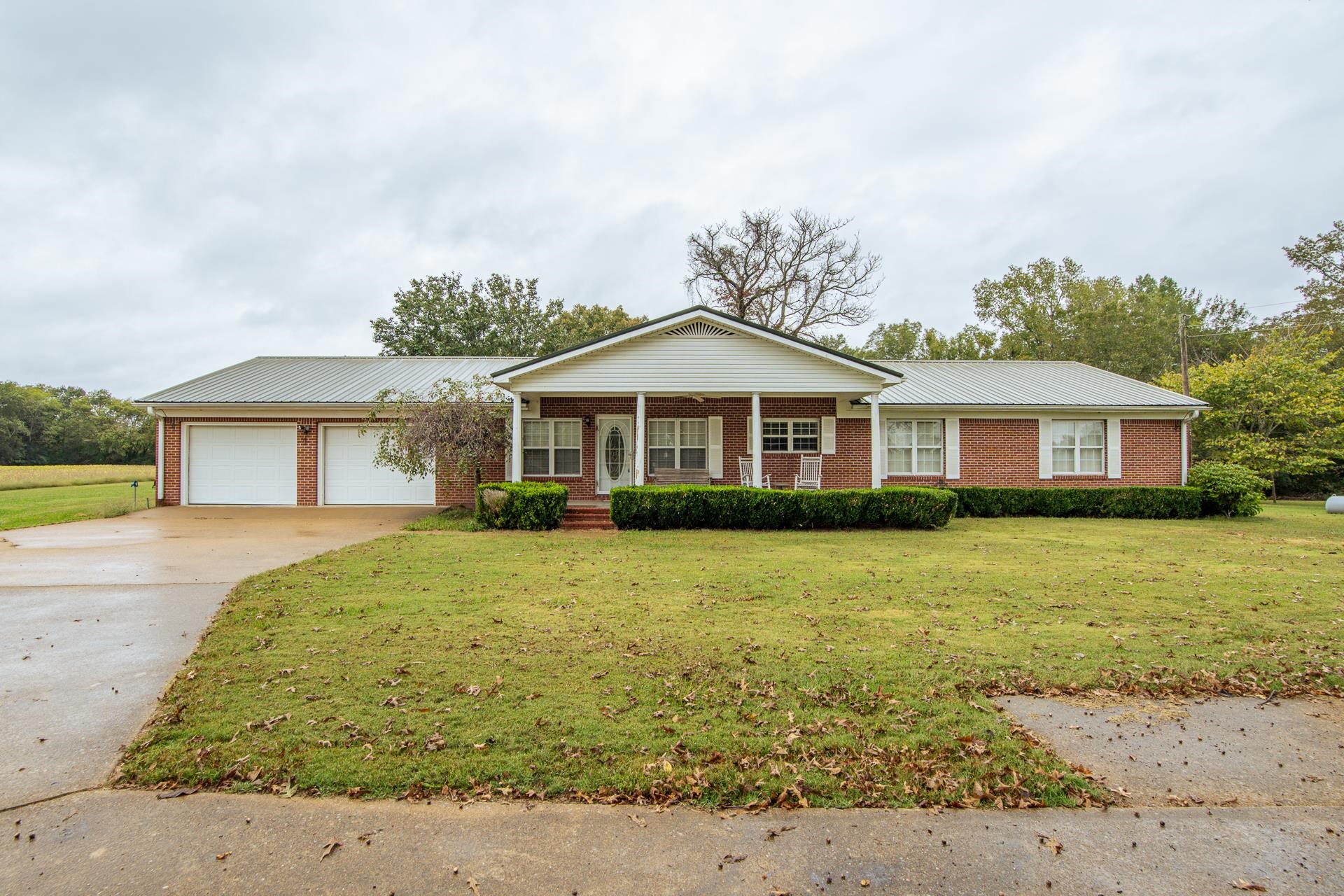 4985 Saltillo Road Saltillo, TN 38370 - Photo 2 of 40 a front view of a house with a garden