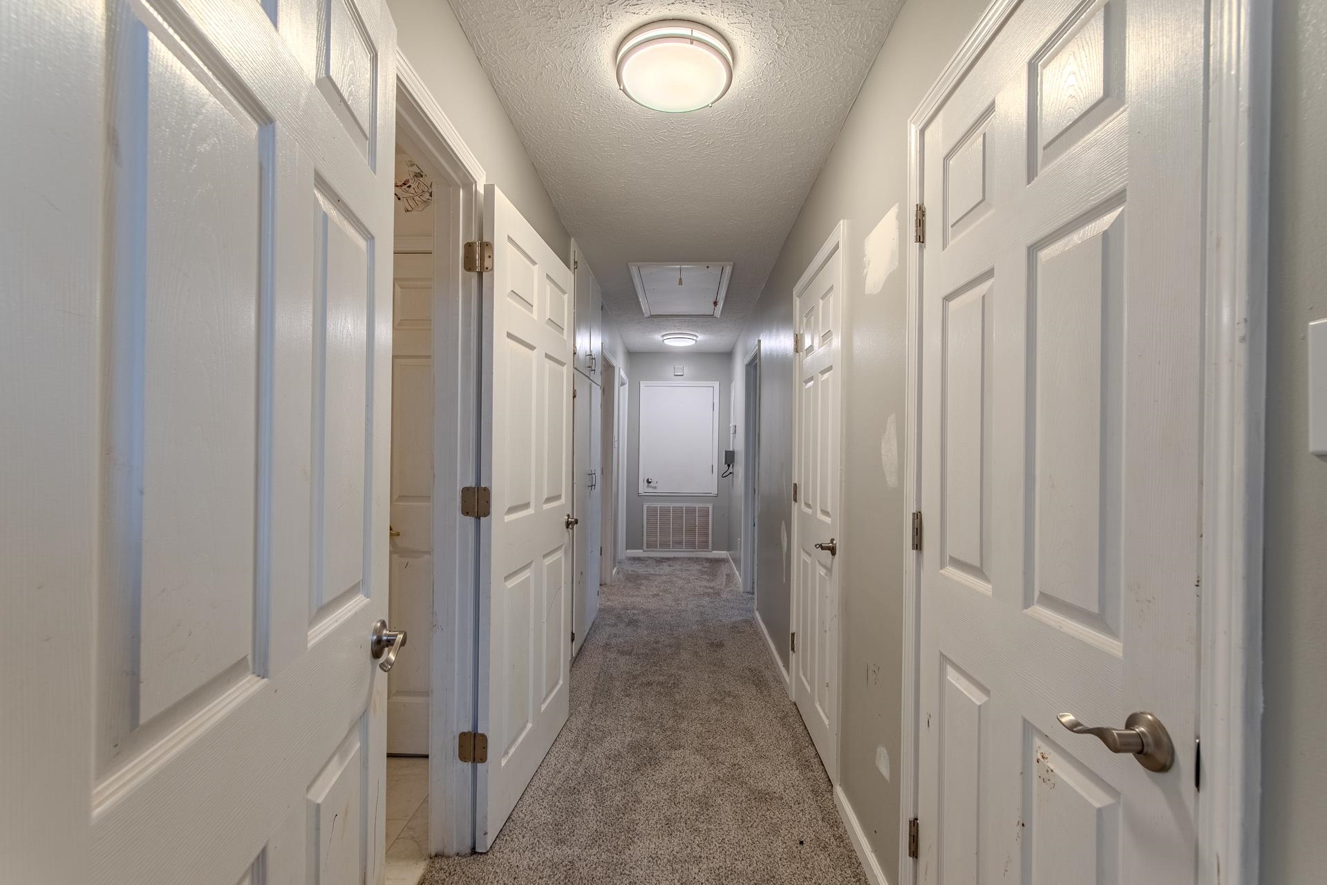 4985 Saltillo Road Saltillo, TN 38370 - Photo 25 of 40 a view of a hallway with a chandelier