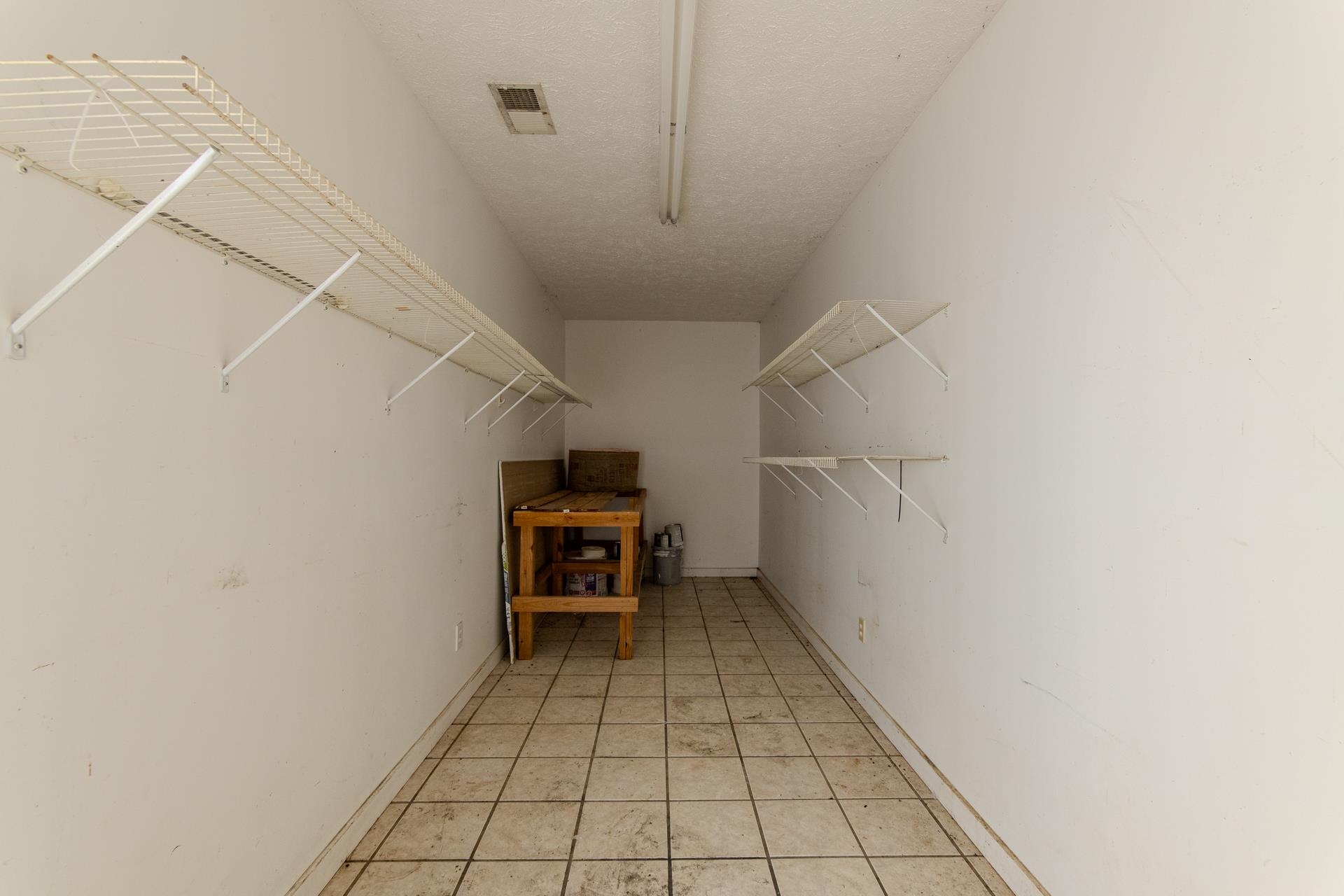 4985 Saltillo Road Saltillo, TN 38370 - Photo 26 of 40 a view of a storage & utility room with racks on the wall