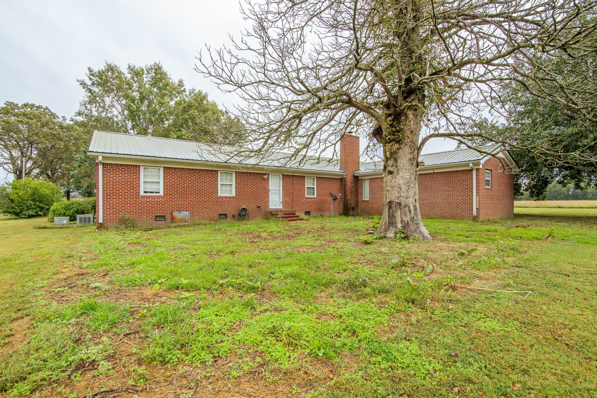 4985 Saltillo Road Saltillo, TN 38370 - Photo 29 of 40 a front view of house with yard and green space