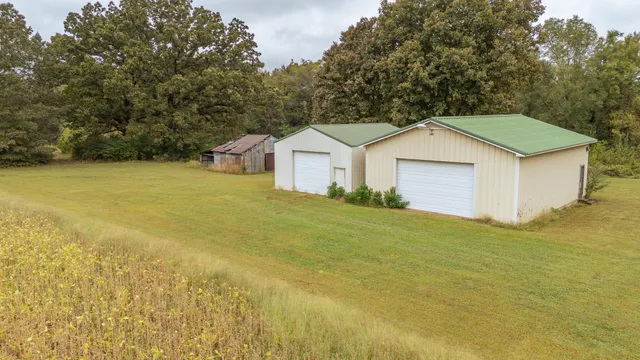 a house with huge green field in front of it