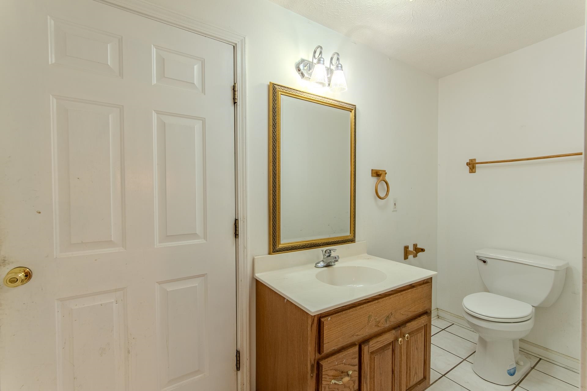 4985 Saltillo Road Saltillo, TN 38370 - Photo 8 of 40 a bathroom with a sink a toilet and shower
