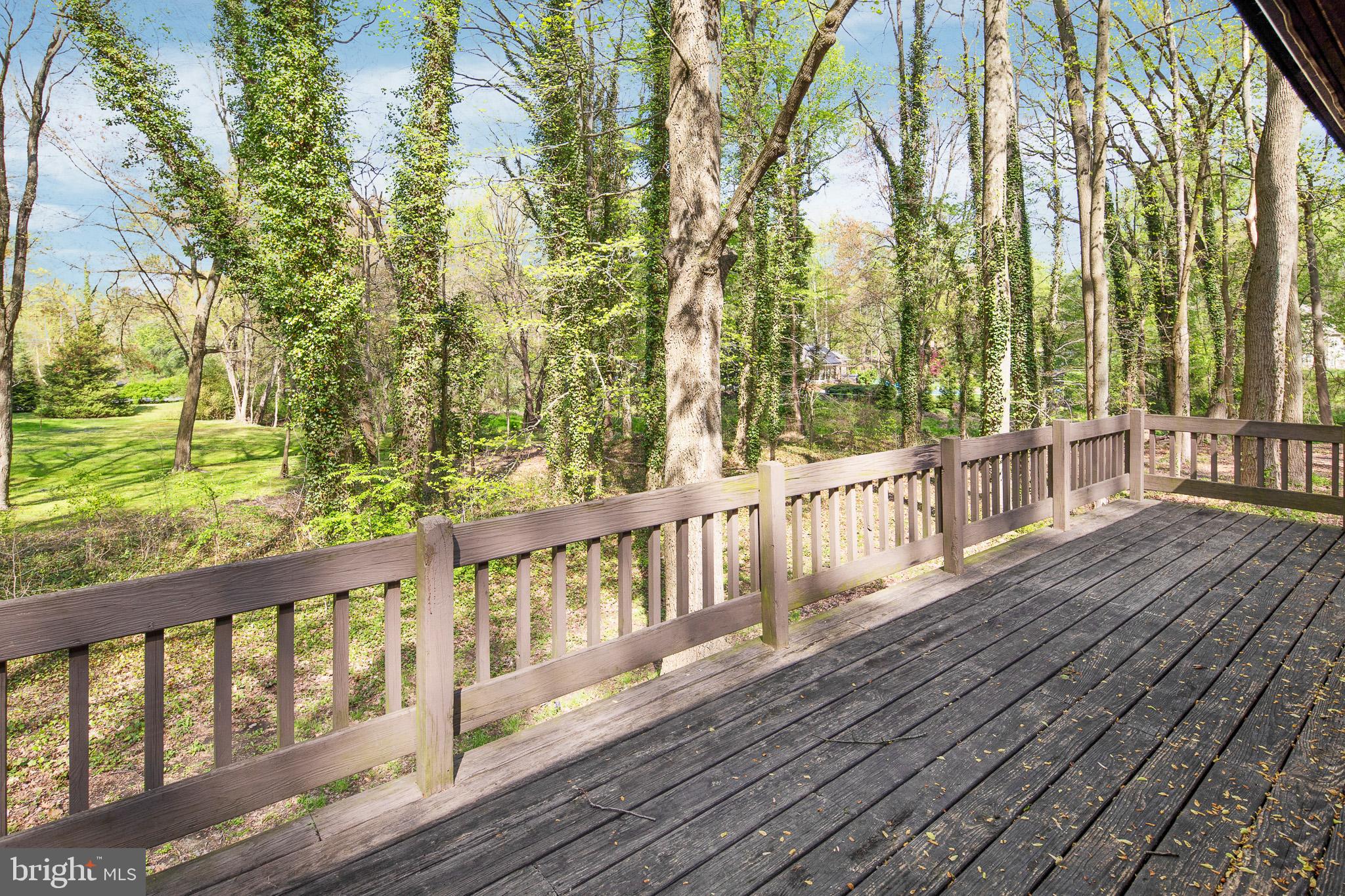 15 Springhill Road Mantua, NJ 08051 - Photo 29 of 34 Lower deck area surrounded by trees