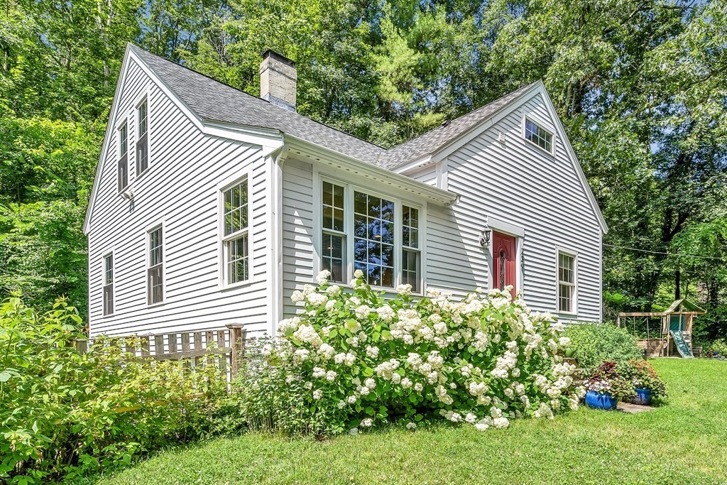 239 Sudbury Road Stow, MA 01775 - Photo 1 of 31 a view of a house with a yard and potted plants