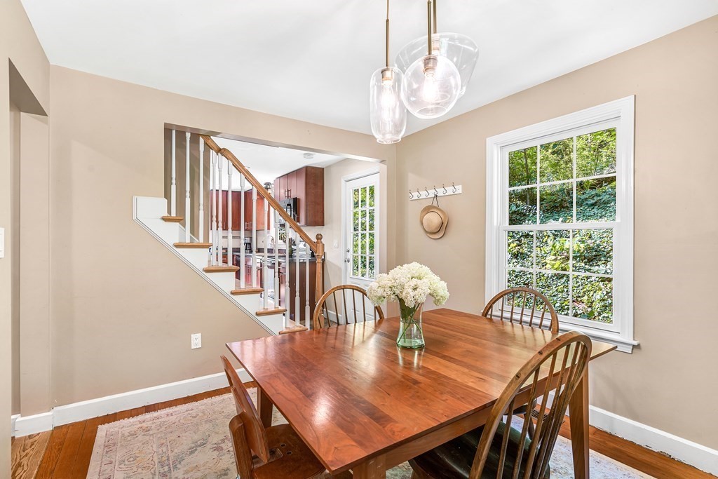 239 Sudbury Road Stow, MA 01775 - Photo 8 of 31 a view of a dining room with furniture a chandelier and wooden floor