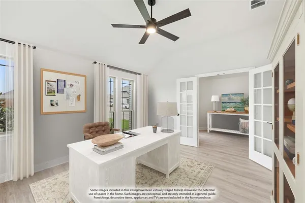 a living room with a furniture a rug and a view of kitchen