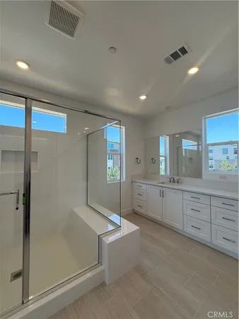 a large bathroom with a large tub and sink