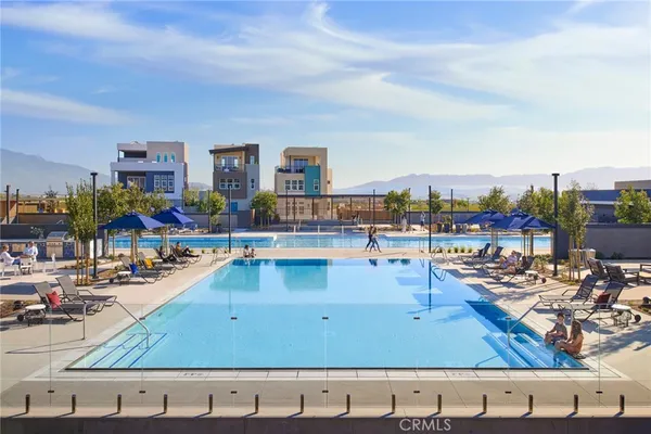 a view of swimming pool with outdoor seating