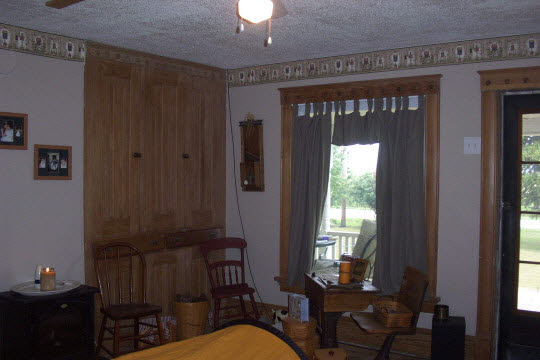 1396 Shabbona Grove Road Shabbona, IL 60550 - Photo 5 of 8 a living room with furniture a window and a potted plant