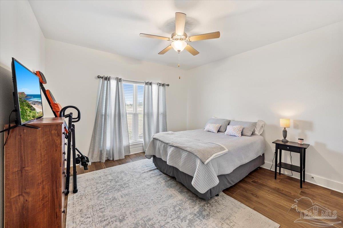 9303 Salter Road Pace, FL 32571 - Photo 15 of 23 a bedroom with a bed closet and a window