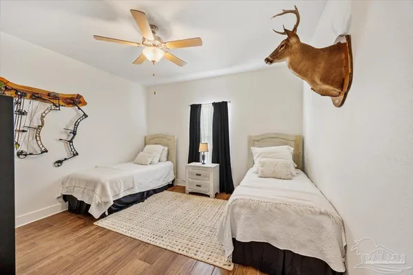 a bedroom with a bed and window