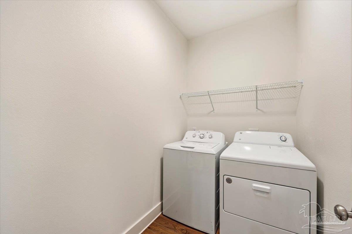 9303 Salter Road Pace, FL 32571 - Photo 18 of 23 a utility room with dryer and washer