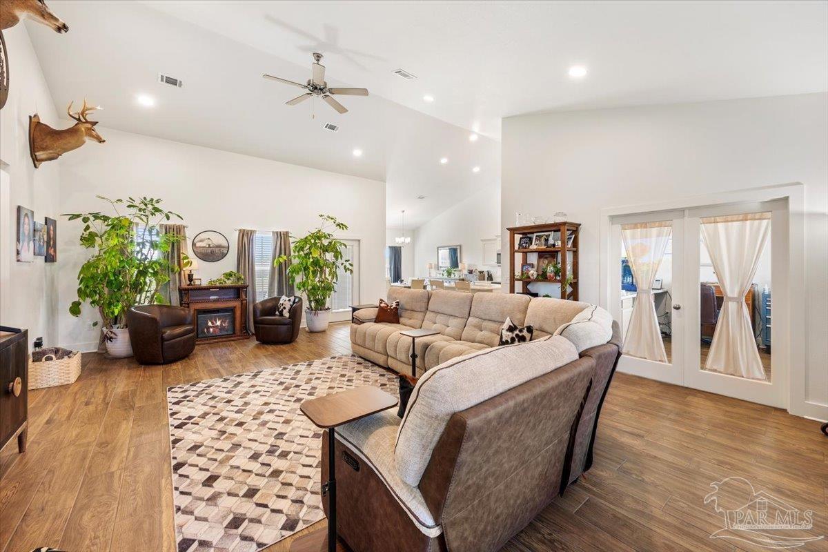 9303 Salter Road Pace, FL 32571 - Photo 4 of 23 a living room with furniture and a large window