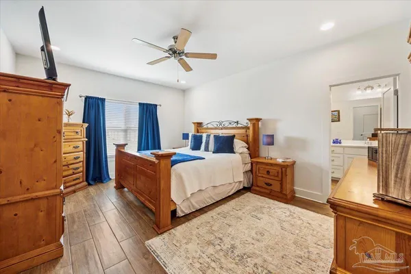 a bed room with a bed and dresser