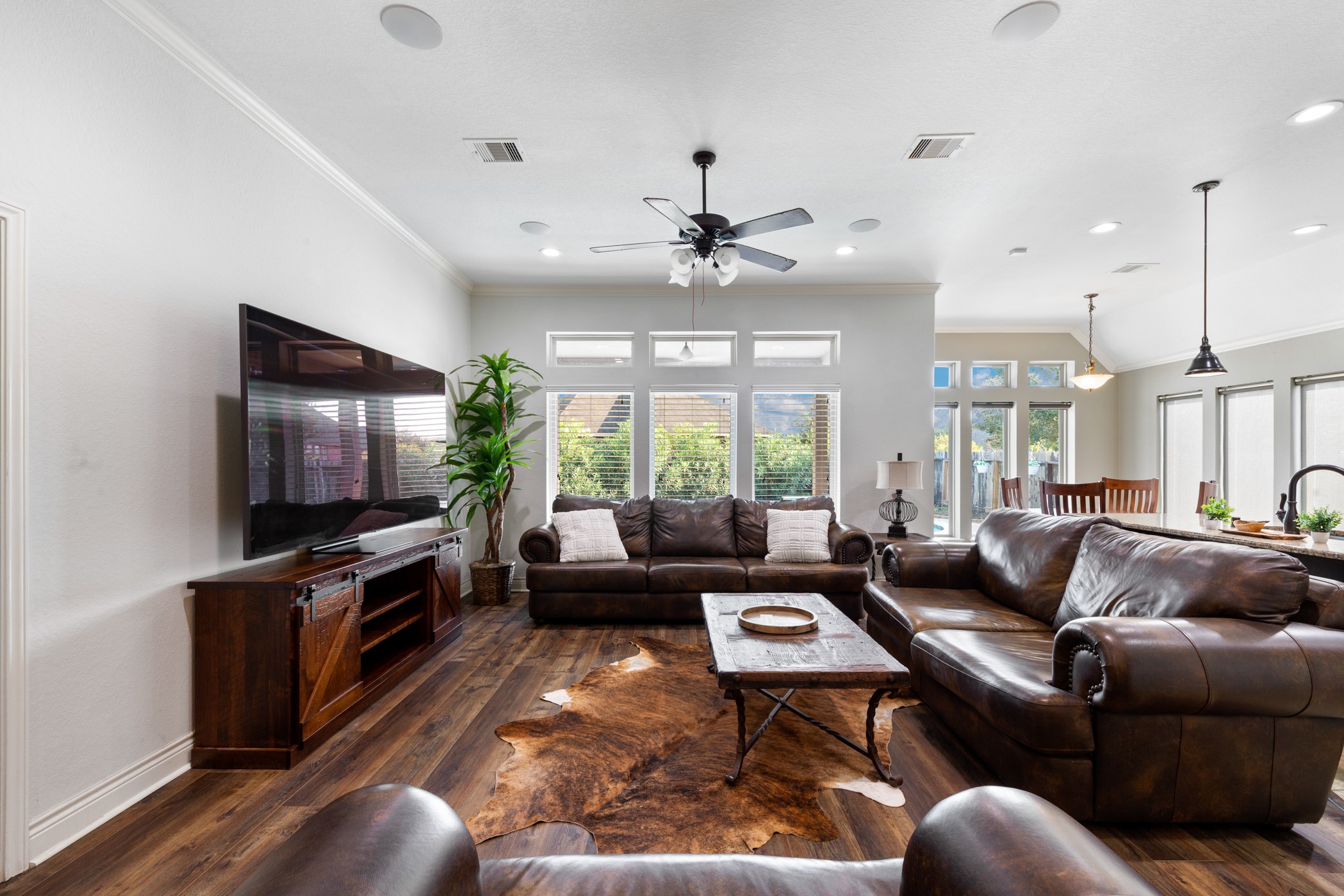1235 Oxbow Crossing Lane Rosenberg, TX 77471 - Photo 11 of 34 a living room with furniture ceiling fan and a flat screen tv