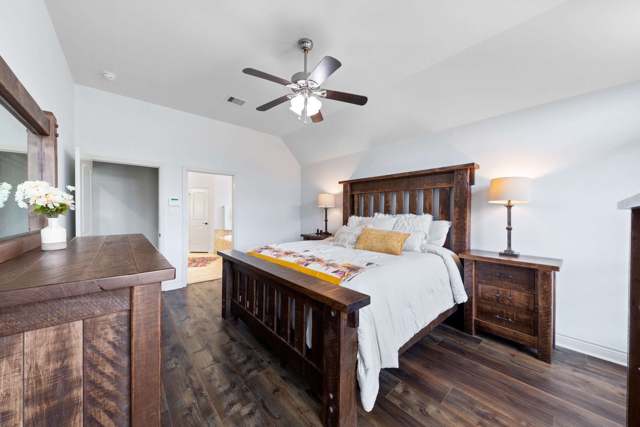 1235 Oxbow Crossing Lane Rosenberg, TX 77471 - Photo 21 of 34 a bedroom with a bed table and a chandelier