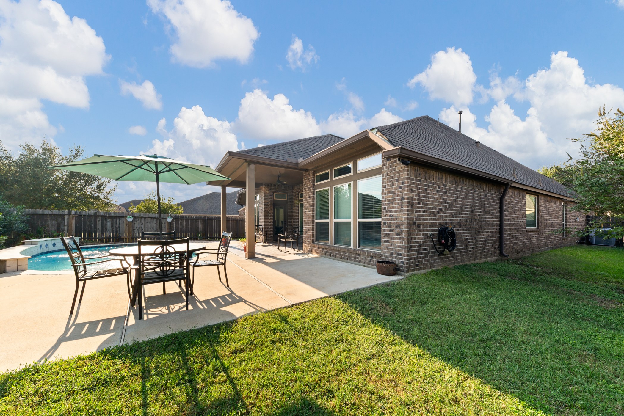 1235 Oxbow Crossing Lane Rosenberg, TX 77471 - Photo 29 of 34 a view of a house with backyard porch and sitting area
