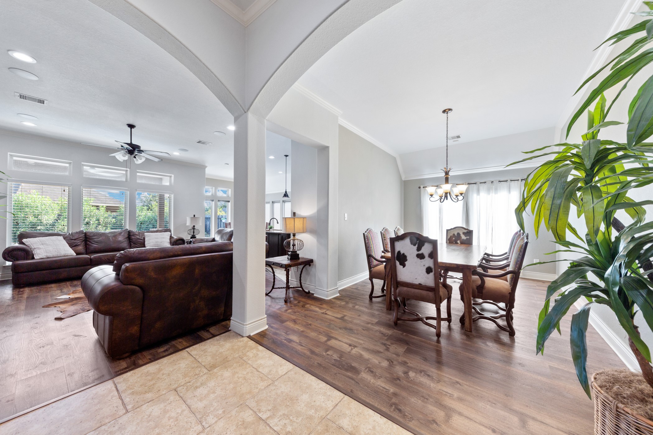 1235 Oxbow Crossing Lane Rosenberg, TX 77471 - Photo 34 of 34 a living room with furniture a chandelier and a floor to ceiling window