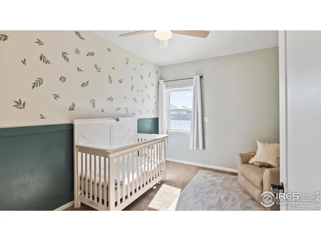 a black and white photo of a bedroom