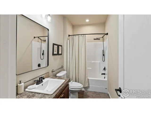 a bathroom with a sink double vanity and a mirror
