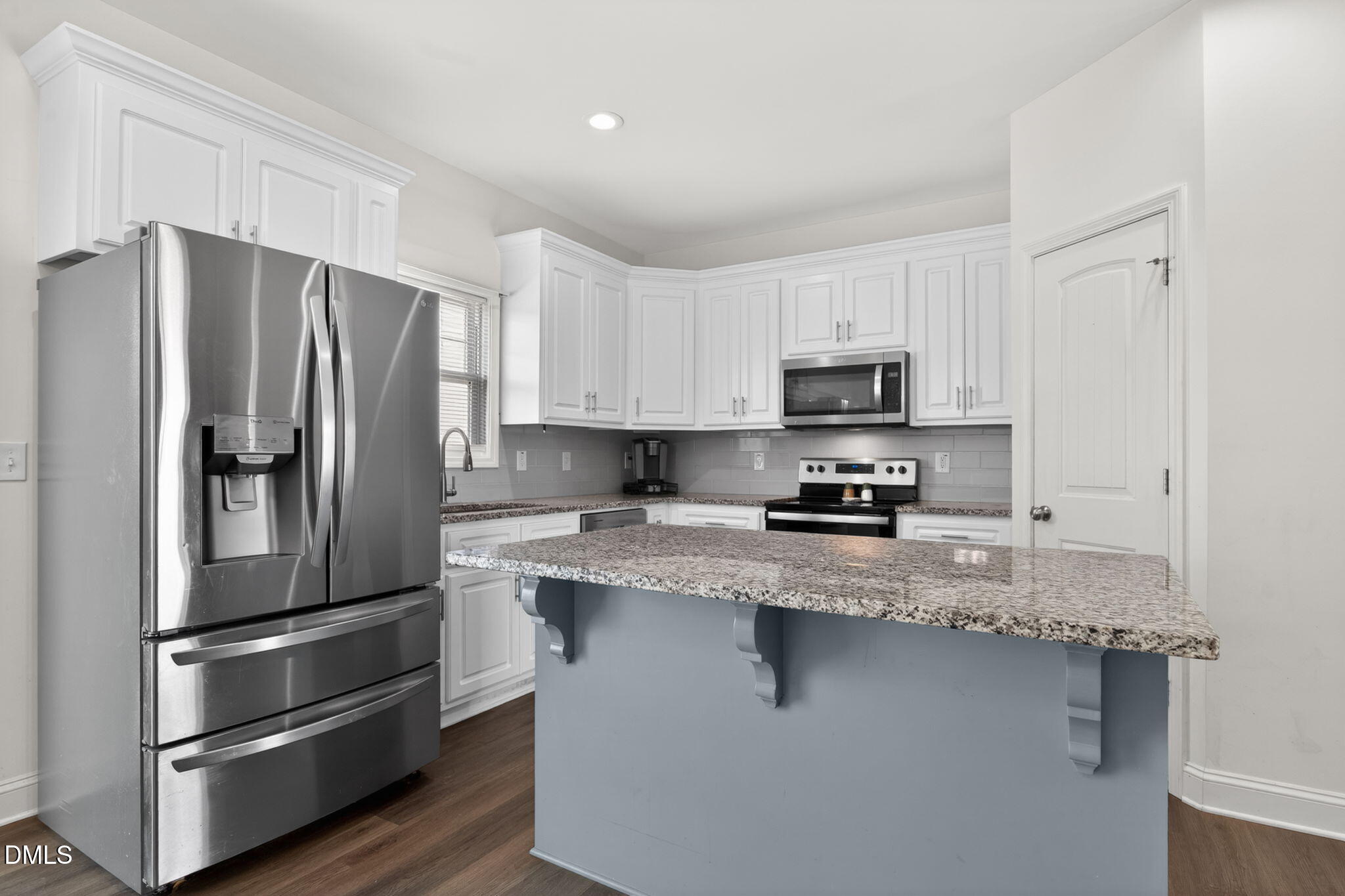9084 Byron Court Bailey, NC 27807 - Photo 12 of 40 a kitchen with stainless steel appliances granite countertop a refrigerator stove and microwave
